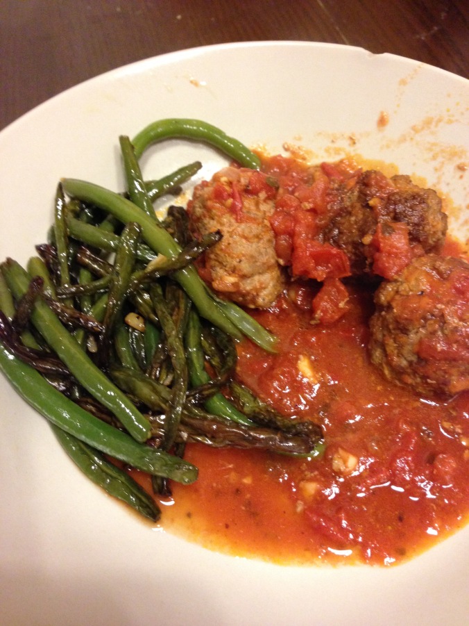 Homemade meatballs with a fresh sauce and some green beans