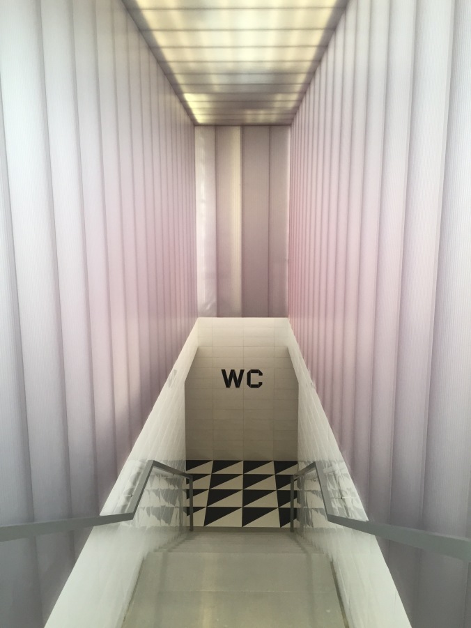 Wes Anderson designed bathroom entrance at Bar Luce at Fondazione Prada